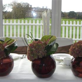 fwthumbContemporary row of bronze globe vases with hydrangea & anthurium.jpg
